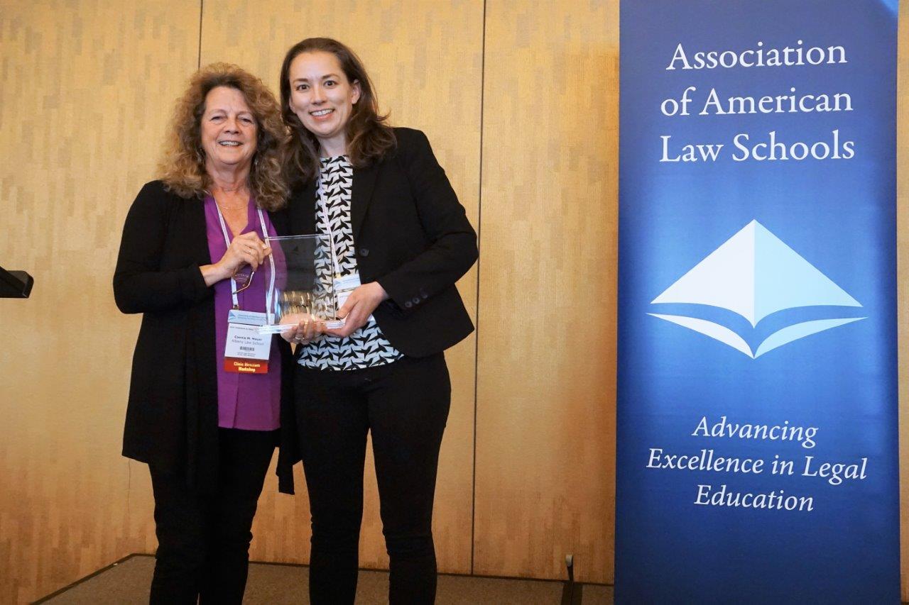 Albany Law Associate Dean Connie Mayer presents the 2019 Shanara Gilbert Award to Albany Law Professor Sarah Rogerson.